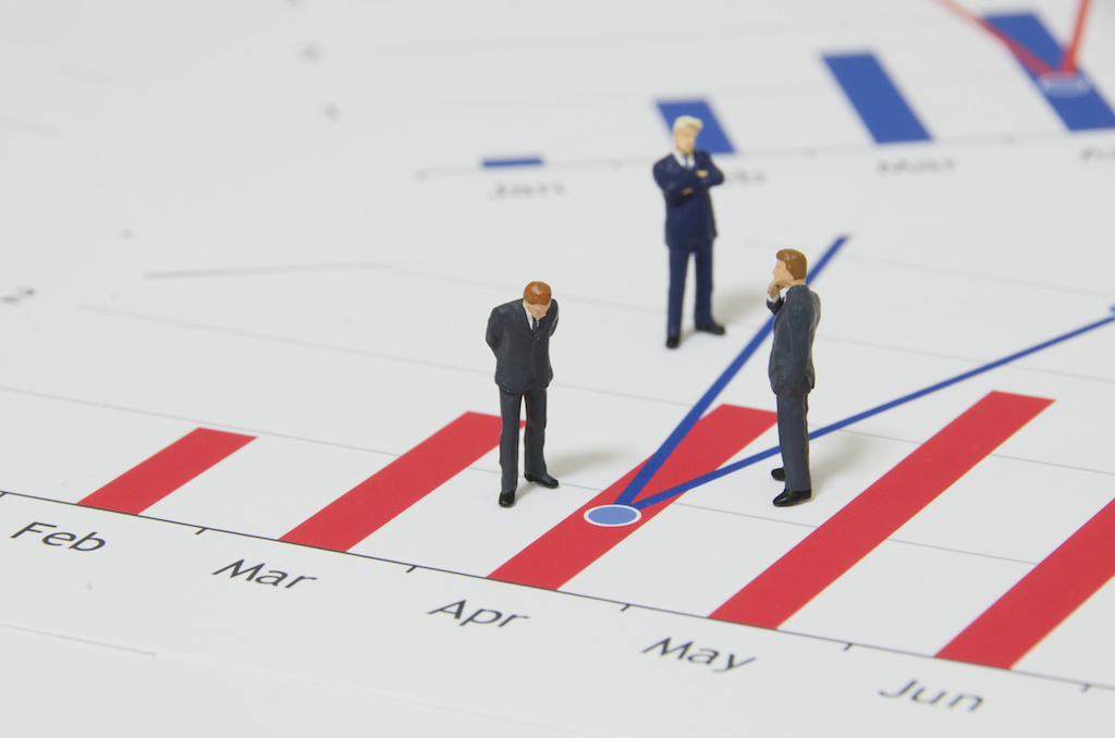 Managers looking at a data point