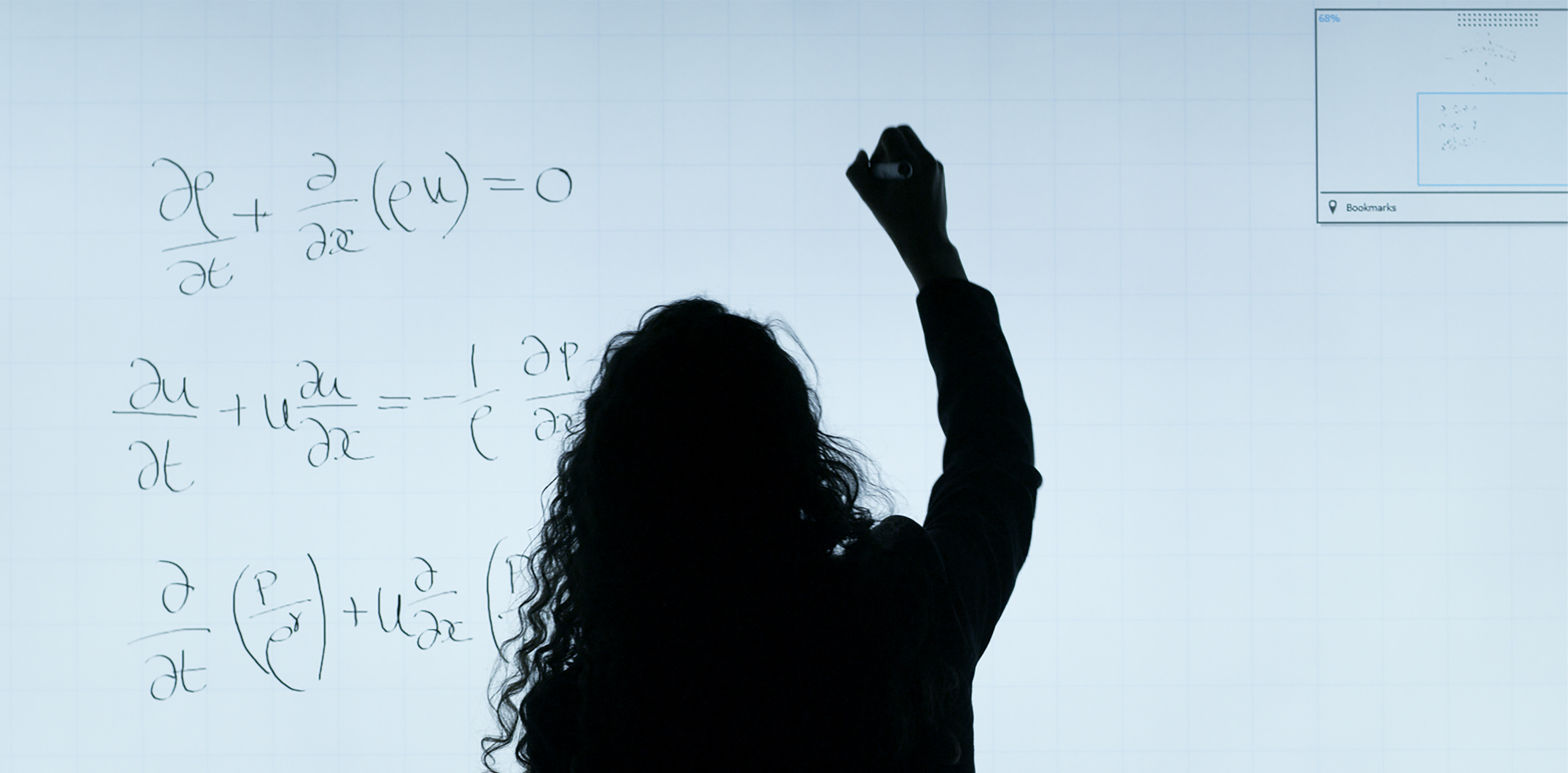 woman writing equations